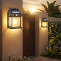 Solar wall lamp mounted on Pakistani home gate at dusk